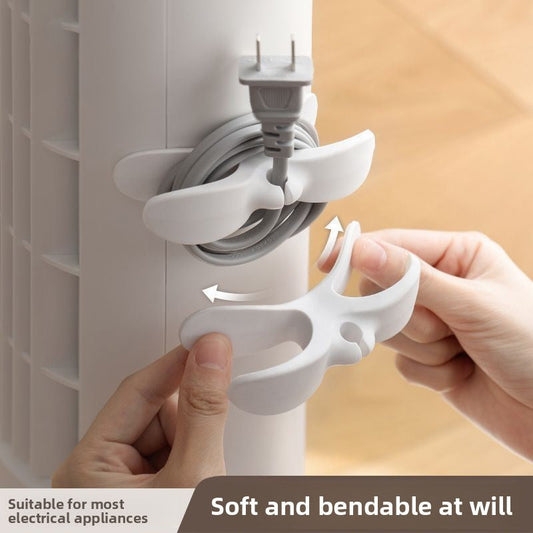 White self-adhesive cable organizer holding an appliance cord