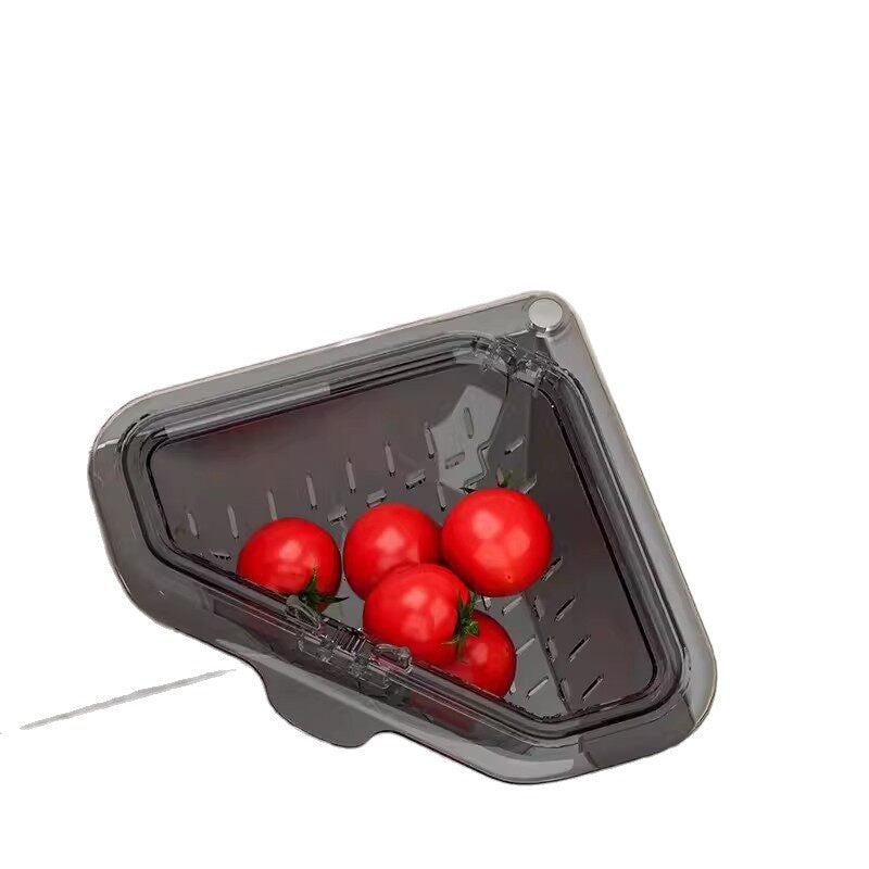 Translucent gray corner sink basket holding tomatoes