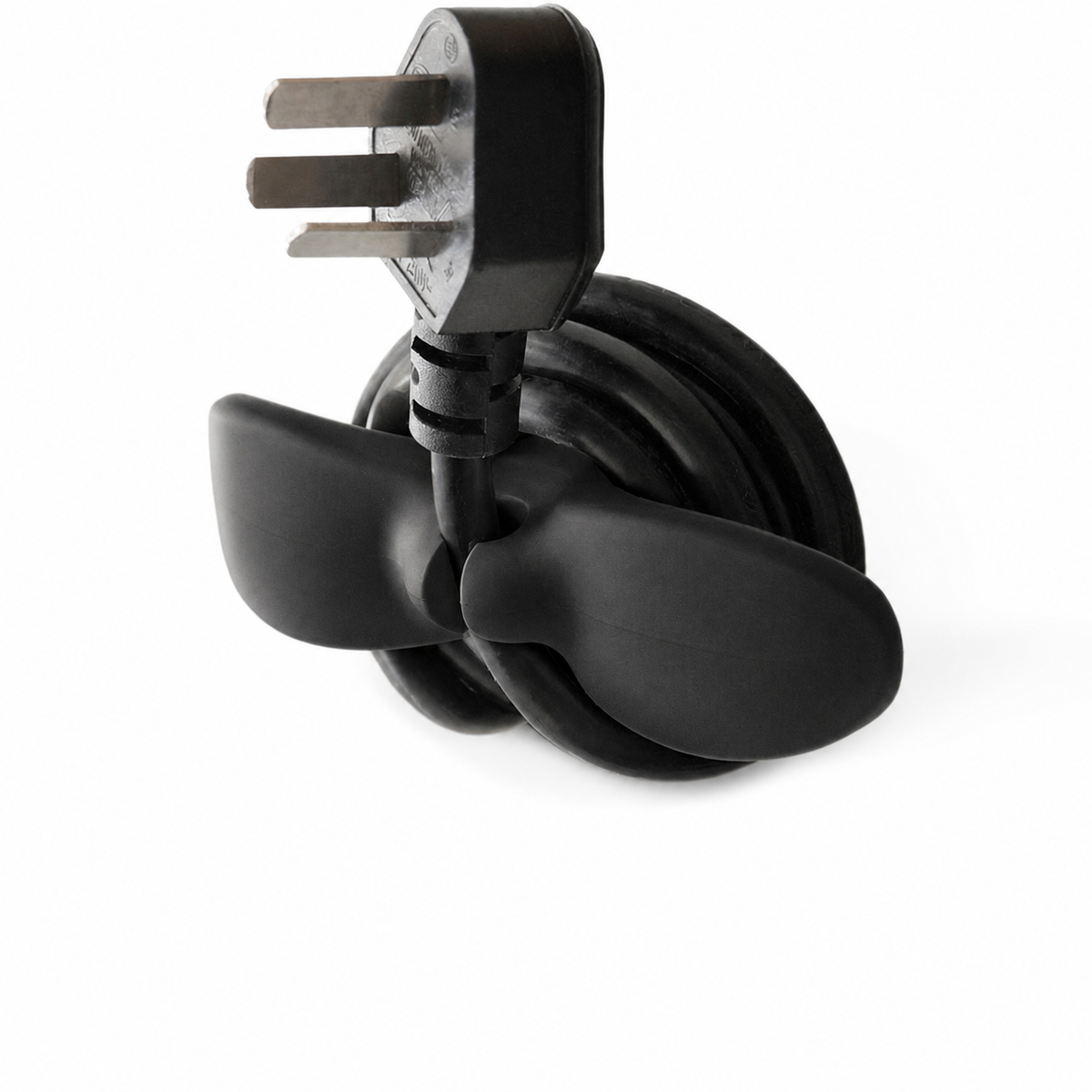 Black self-adhesive cable and plug organizer holding a wrapped cord